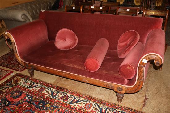 A Regency mahogany lyre shaped settee, with buttoned seat and bolsters(-)